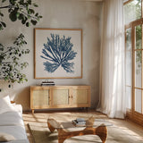 Pacific Sea Mosses Blue on White II by Wild Apple Portfolio. Shown in a natural wood frame in a cozy modern living room. Available as an archival giclee rolled canvas, fine art paper, or poster print. SKU 53892a.