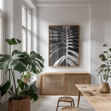 Palm Detail II BW by Wild Apple Portfolio. shown as a print in a natural wood frame in a dining room. Available as a archival giclee rolled canvas, fine art paper, or poster print. SKU 56305h.