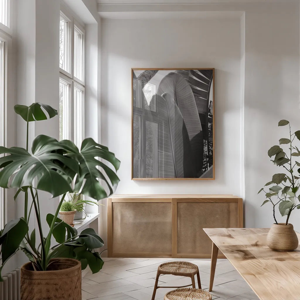Palm Detail IV BW by Wild Apple Portfolio. shown as a print in a natural wood frame in a dining room. Available as a archival giclee rolled canvas, fine art paper, or poster print. SKU 56307h.