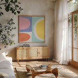 Pastel II by Wild Apple Portfolio. Shown in a natural wood frame in a cozy modern living room. Available as an archival giclee rolled canvas, fine art paper, or poster print. SKU 84105a.