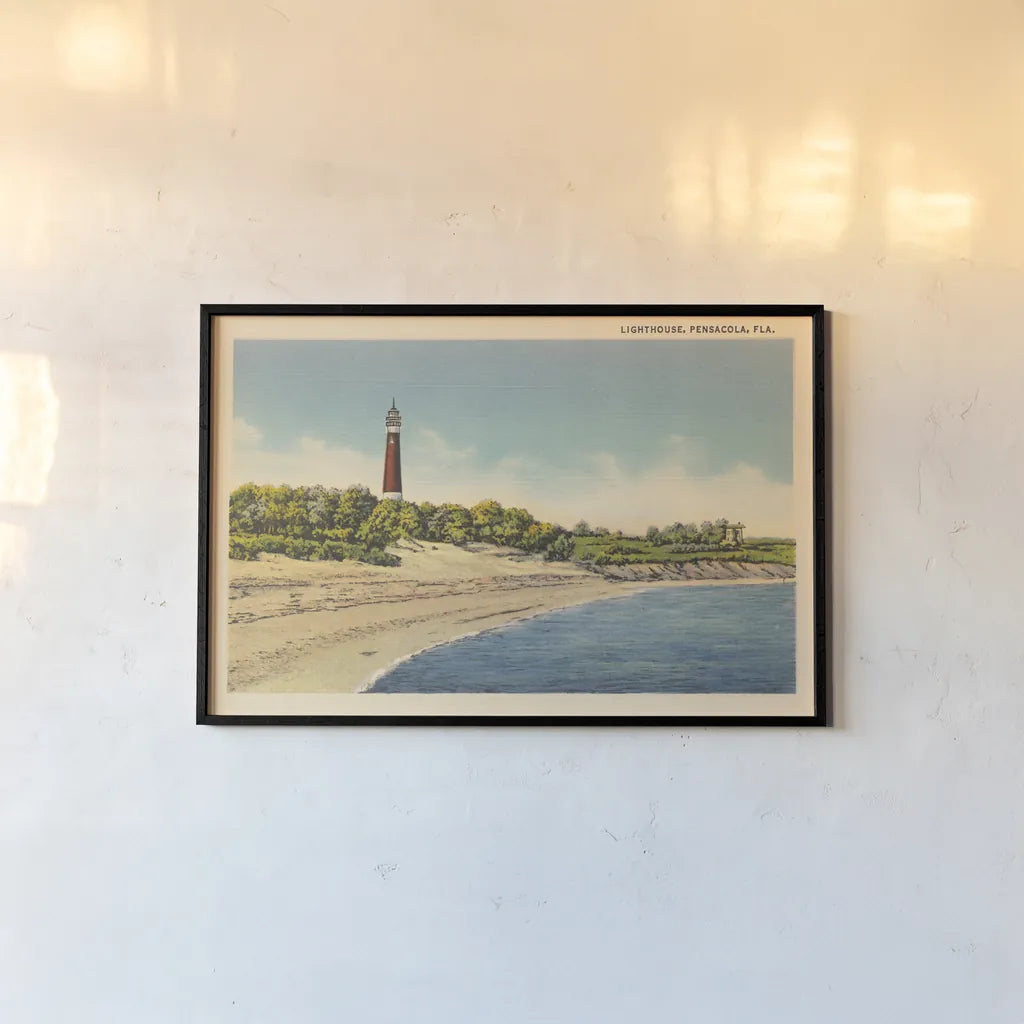 Pensacola Lighthouse by Wild Apple Portfolio. shown as a paper print in a black flame. Available as a archival giclee rolled canvas, fine art paper, or poster print. SKU 75651i.