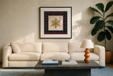 Plaid Christmas Stamp II by Wild Apple Portfolio. Displayed in a glass frame with matte in a clean modern living room. Available as an archival giclee rolled canvas, fine art paper, or poster print. SKU 102667a.