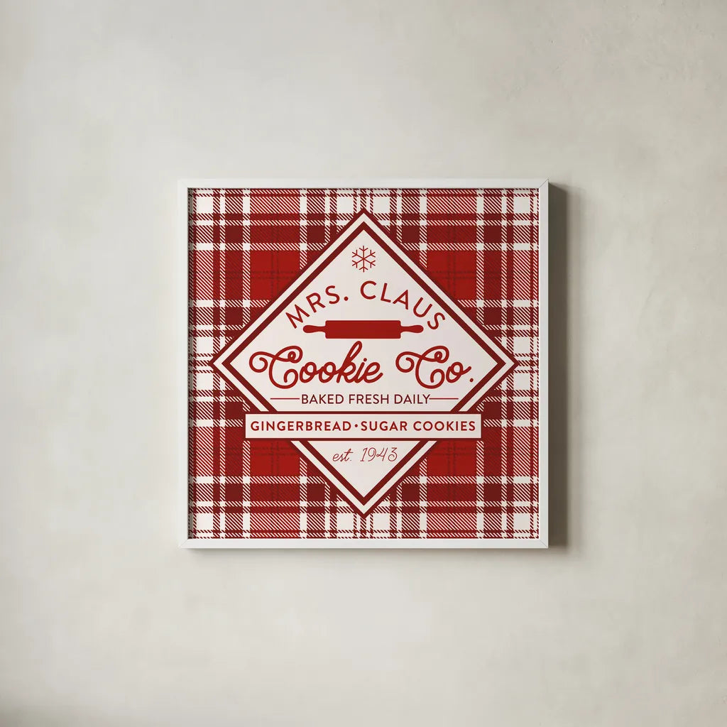 Plaid Holidays IV Red by Wild Apple Portfolio. Shown in a crisp white glass frame for a clean and minimalist style. Available as an archival giclee rolled canvas, fine art paper, or poster print. SKU 64771a.