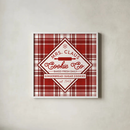 Plaid Holidays IV Red by Wild Apple Portfolio. Shown in a crisp white glass frame for a clean and minimalist style. Available as an archival giclee rolled canvas, fine art paper, or poster print. SKU 64771a.