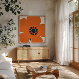Pop Art Floral I Orange by Wild Apple Portfolio. Shown in a natural wood frame in a cozy modern living room. Available as an archival giclee rolled canvas, fine art paper, or poster print. SKU 54536a.