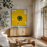 Pop Art Floral I Yellow by Wild Apple Portfolio. Shown in a natural wood frame in a cozy modern living room. Available as an archival giclee rolled canvas, fine art paper, or poster print. SKU 54535a.