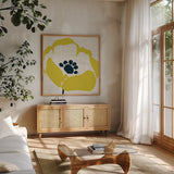 Pop Art Floral III Yellow Newsprint by Wild Apple Portfolio. Shown in a natural wood frame in a cozy modern living room. Available as an archival giclee rolled canvas, fine art paper, or poster print. SKU 52824a.