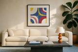Quarter Circle Abstract Sq IV Bright Primary by Wild Apple Portfolio. Displayed in a glass frame with matte in a clean modern living room. Available as an archival giclee rolled canvas, fine art paper, or poster print. SKU 82318a.
