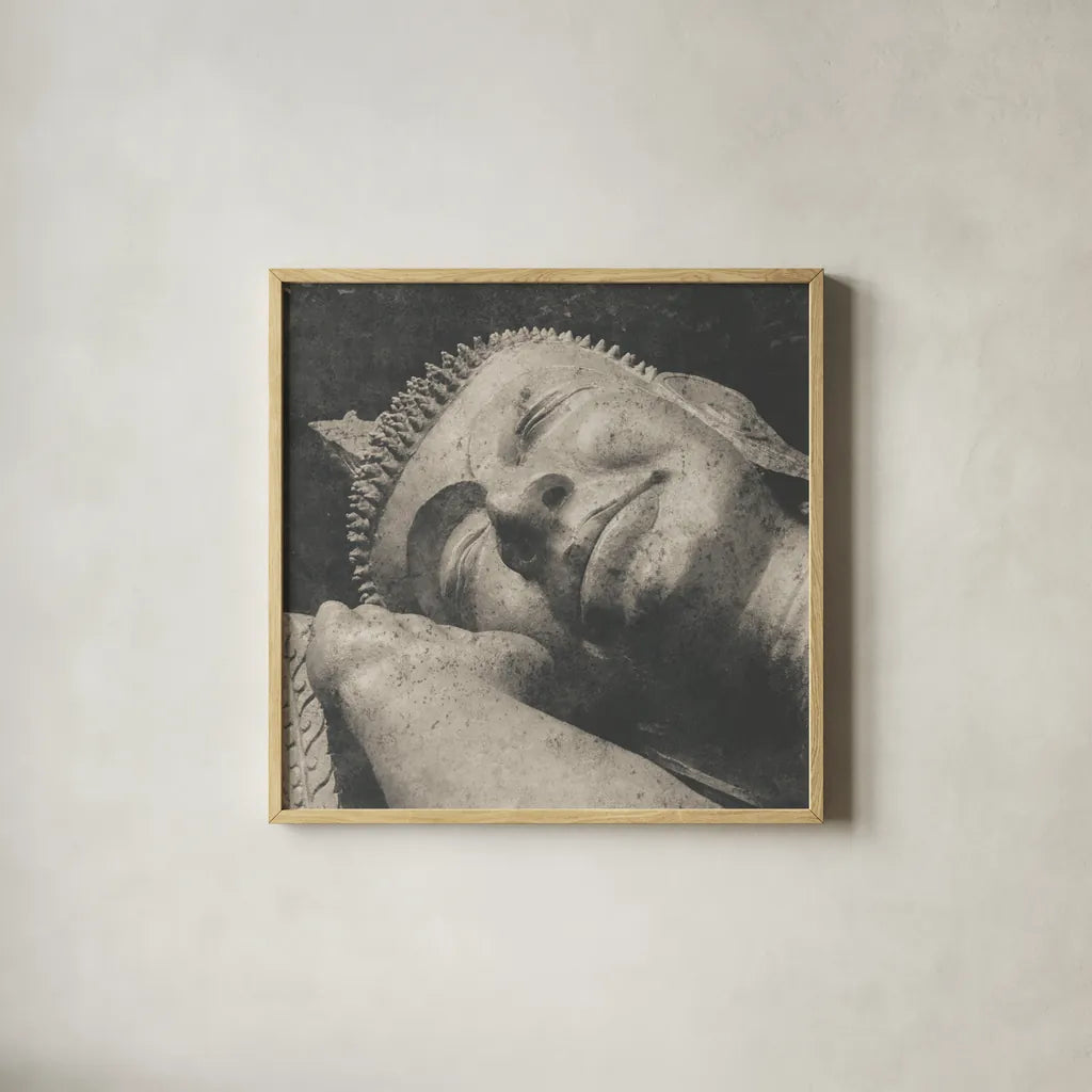 Reclining Buddha by Wild Apple Portfolio. Shown in a natural wood glass frame for a timeless modern aesthetic. Available as an archival giclee rolled canvas, fine art paper, or poster print. SKU 38801a.