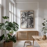 Riviera Palms II BW by Wild Apple Portfolio. shown as a print in a natural wood frame in a dining room. Available as a archival giclee rolled canvas, fine art paper, or poster print. SKU 75167h.