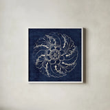 Rosette IV Indigo by Wild Apple Portfolio. Shown in a crisp white glass frame for a clean and minimalist style. Available as an archival giclee rolled canvas, fine art paper, or poster print. SKU 23699a.