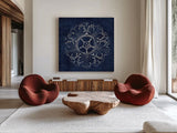 Rosette VI Indigo by Wild Apple Portfolio. Shown as extra-large giant wall art in a modern living room. Available as an archival giclee rolled canvas, fine art paper, or poster print. SKU 23701a.
