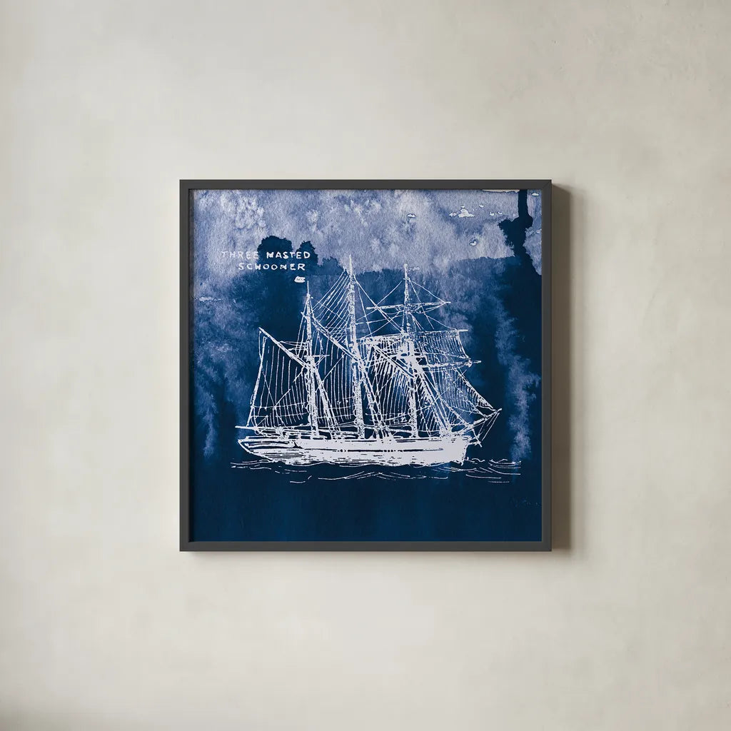 Sailing Ships II Indigo by Wild Apple Portfolio. Shown in a sleek black glass frame for a contemporary gallery look. Available as an archival giclee rolled canvas, fine art paper, or poster print. SKU 32099a.
