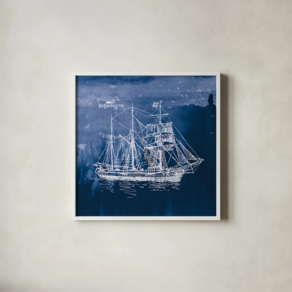 Sailing Ships III Indigo by Wild Apple Portfolio. Shown in a crisp white glass frame for a clean and minimalist style. Available as an archival giclee rolled canvas, fine art paper, or poster print. SKU 32100a.