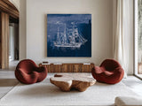 Sailing Ships III Indigo by Wild Apple Portfolio. Shown as extra-large giant wall art in a modern living room. Available as an archival giclee rolled canvas, fine art paper, or poster print. SKU 32100a.