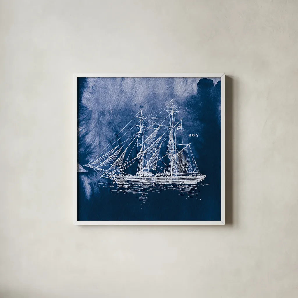 Sailing Ships IV Indigo by Wild Apple Portfolio. Shown in a crisp white glass frame for a clean and minimalist style. Available as an archival giclee rolled canvas, fine art paper, or poster print. SKU 32101a.