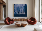 Sailing Ships IV Indigo by Wild Apple Portfolio. Shown as extra-large giant wall art in a modern living room. Available as an archival giclee rolled canvas, fine art paper, or poster print. SKU 32101a.