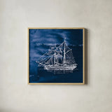 Sailing Ships V Indigo by Wild Apple Portfolio. Shown in a natural wood glass frame for a timeless modern aesthetic. Available as an archival giclee rolled canvas, fine art paper, or poster print. SKU 32102a.