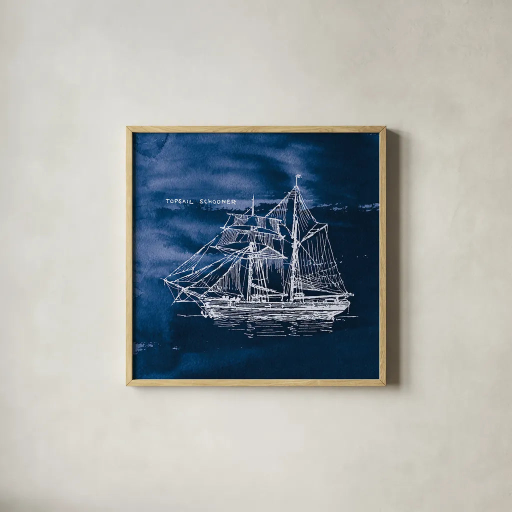 Sailing Ships V Indigo by Wild Apple Portfolio. Shown in a natural wood glass frame for a timeless modern aesthetic. Available as an archival giclee rolled canvas, fine art paper, or poster print. SKU 32102a.
