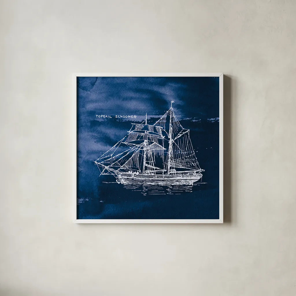Sailing Ships V Indigo by Wild Apple Portfolio. Shown in a crisp white glass frame for a clean and minimalist style. Available as an archival giclee rolled canvas, fine art paper, or poster print. SKU 32102a.