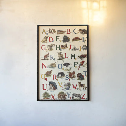 Schoolhouse Alphabet by Wild Apple Portfolio. shown as a paper print in a black flame. Available as a archival giclee rolled canvas, fine art paper, or poster print. SKU 71606h.