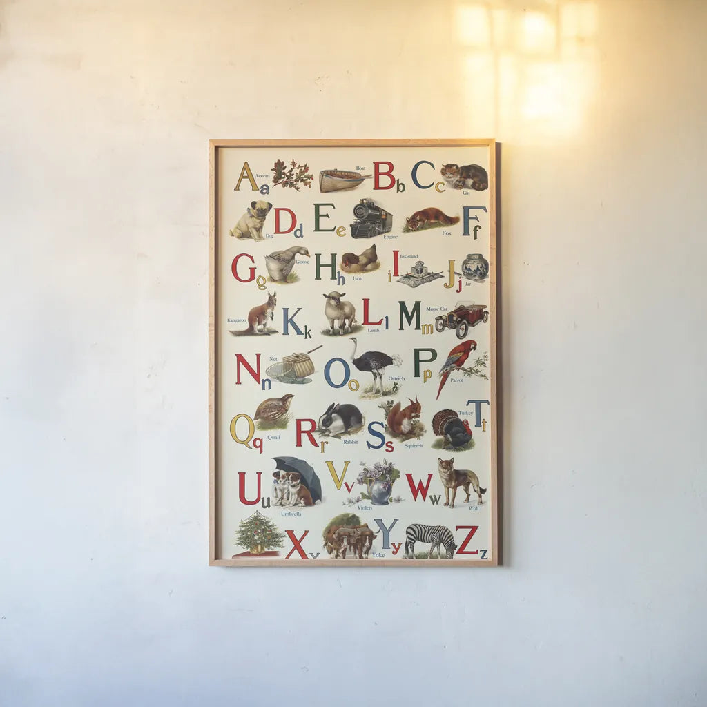 Schoolhouse Alphabet by Wild Apple Portfolio. shown as a paper print in a natural frame. Available as a archival giclee rolled canvas, fine art paper, or poster print. SKU 71606h.