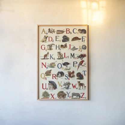 Schoolhouse Alphabet by Wild Apple Portfolio. shown as a paper print in a natural frame. Available as a archival giclee rolled canvas, fine art paper, or poster print. SKU 71606h.