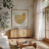 Silver Sea Life Aqua Shell by Wild Apple Portfolio. Shown in a natural wood frame in a cozy modern living room. Available as an archival giclee rolled canvas, fine art paper, or poster print. SKU 29852a.
