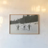 Ski Day by Wild Apple Portfolio. shown as a paper print in a natural frame. Available as a archival giclee rolled canvas, fine art paper, or poster print. SKU 75782i.