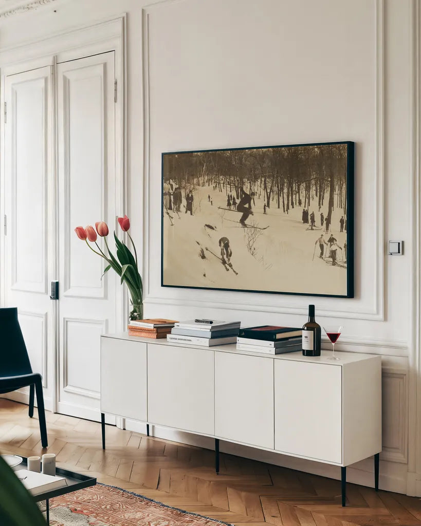 Skiing I by Wild Apple Portfolio. shown as a framed stretched canvas in a living room above a console. Available as a archival giclee rolled canvas, fine art paper, or poster print. SKU 73288i.