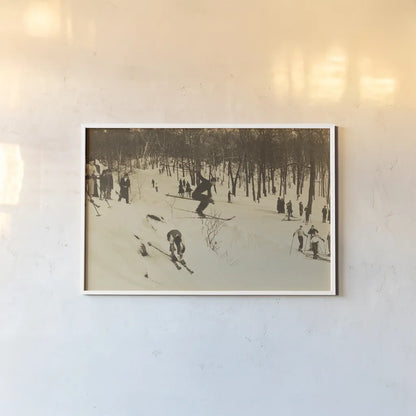 Skiing I by Wild Apple Portfolio. shown as a paper print in a white frame. Available as a archival giclee rolled canvas, fine art paper, or poster print. SKU 73288i.