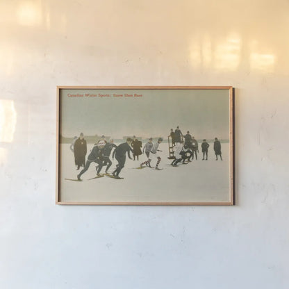 Snow Shoe Race by Wild Apple Portfolio. shown as a paper print in a natural frame. Available as a archival giclee rolled canvas, fine art paper, or poster print. SKU 70704i.