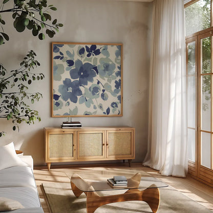 Soft Blue Florals II by Wild Apple Portfolio. Shown in a natural wood frame in a cozy modern living room. Available as an archival giclee rolled canvas, fine art paper, or poster print. SKU 56490a.