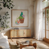 Succulent Garden I by Wild Apple Portfolio. Shown in a natural wood frame in a cozy modern living room. Available as an archival giclee rolled canvas, fine art paper, or poster print. SKU 21555a.
