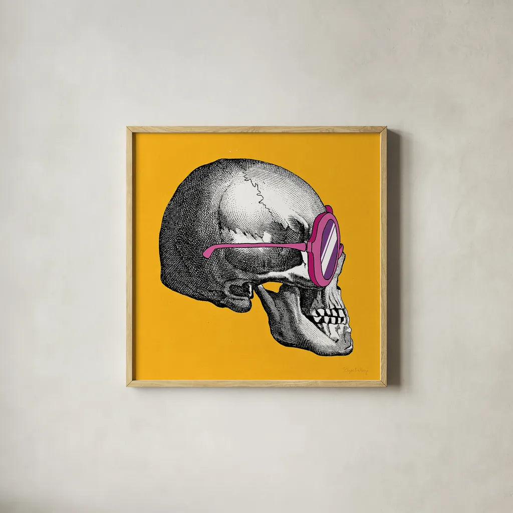 Sunny Skull I by Wild Apple Portfolio. Shown in a natural wood glass frame for a timeless modern aesthetic. Available as an archival giclee rolled canvas, fine art paper, or poster print. SKU 21659a.
