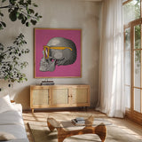 Sunny Skull IV by Wild Apple Portfolio. Shown in a natural wood frame in a cozy modern living room. Available as an archival giclee rolled canvas, fine art paper, or poster print. SKU 21662a.