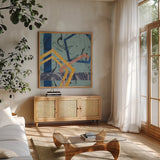Terrazzo I Blue by Wild Apple Portfolio. Shown in a natural wood frame in a cozy modern living room. Available as an archival giclee rolled canvas, fine art paper, or poster print. SKU 51933a.