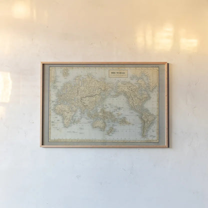 The World Map Neutral by Wild Apple Portfolio. shown as a paper print in a natural frame. Available as a archival giclee rolled canvas, fine art paper, or poster print. SKU 51556i.