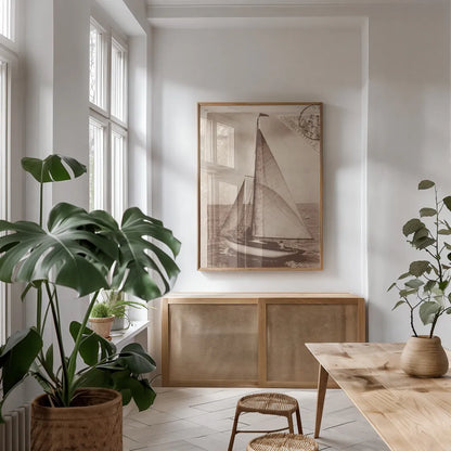 Vintage Sailing II Sepia by Wild Apple Portfolio. shown as a print in a natural wood frame in a dining room. Available as a archival giclee rolled canvas, fine art paper, or poster print. SKU 47262h.