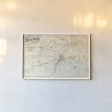 Vintage St Louis Map v2 by Wild Apple Portfolio. shown as a paper print in a white frame. Available as a archival giclee rolled canvas, fine art paper, or poster print. SKU 68692i.