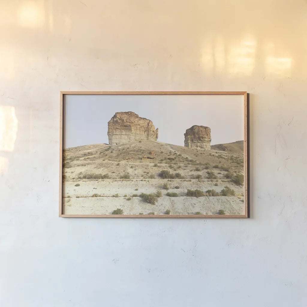 Western Buttes by Wild Apple Portfolio. shown as a paper print in a natural frame. Available as a archival giclee rolled canvas, fine art paper, or poster print. SKU 74443i.