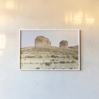 Western Buttes by Wild Apple Portfolio. shown as a paper print in a white frame. Available as a archival giclee rolled canvas, fine art paper, or poster print. SKU 74443i.