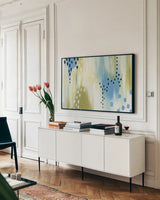 Abstract Aqua Vibe by Yvette St. Amant. shown as a framed stretched canvas in a living room above a console. Available as a archival giclee rolled canvas, fine art paper, or poster print. SKU 88230i.