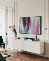 Abstract Tropic Vibe I by Yvette St. Amant. shown as a framed stretched canvas in a living room above a console. Available as a archival giclee rolled canvas, fine art paper, or poster print. SKU 88232i.