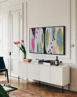 Abstract Tropic Vibe II by Yvette St. Amant. shown as a framed stretched canvas in a living room above a console. Available as a archival giclee rolled canvas, fine art paper, or poster print. SKU 88233i.