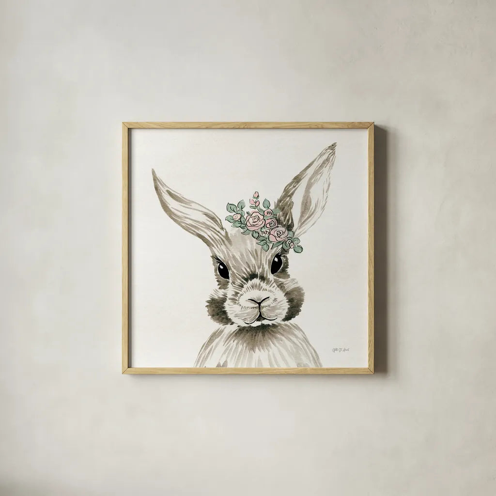 Baby Bunny with Crown by Yvette St. Amant. Shown in a natural wood glass frame for a timeless modern aesthetic. Available as an archival giclee rolled canvas, fine art paper, or poster print. SKU 89943a.