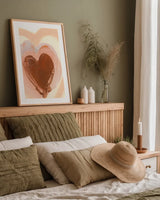 Baby Love Heart by Yvette St. Amant. shown as a paper print in a natural frame. Available as a archival giclee rolled canvas, fine art paper, or poster print. SKU 89996h.