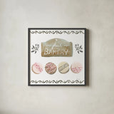 Bake Shoppe I by Yvette St. Amant. Shown in a sleek black glass frame for a contemporary gallery look. Available as an archival giclee rolled canvas, fine art paper, or poster print. SKU 96780a.