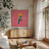 Birds of Paradise III by Yvette St. Amant. Shown in a natural wood frame in a cozy modern living room. Available as an archival giclee rolled canvas, fine art paper, or poster print. SKU 92316a.