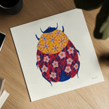 Blooming Beetle III by Yvette St. Amant. Shown as a detailed flat fine art print, highlighting archival giclee quality. Available as an archival giclee rolled canvas, fine art paper, or poster print. SKU 90897a.